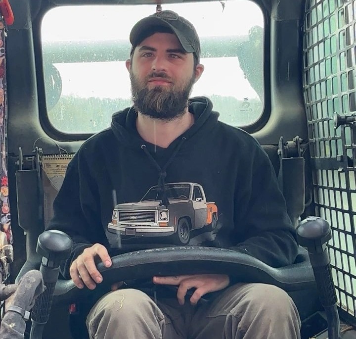 Sean Healy, owner of SMH Excavation, operating skid steer equipment